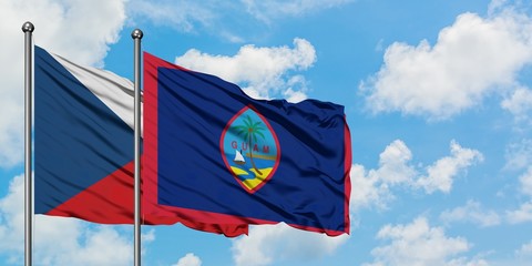 Czech Republic and Guam flag waving in the wind against white cloudy blue sky together. Diplomacy concept, international relations.