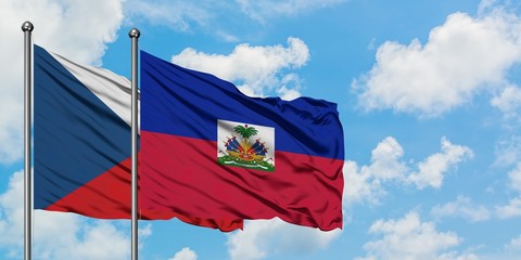 Czech Republic and Haiti flag waving in the wind against white cloudy blue sky together. Diplomacy concept, international relations.