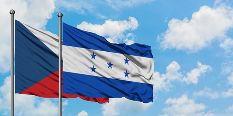 Czech Republic and Honduras flag waving in the wind against white cloudy blue sky together. Diplomacy concept, international relations.