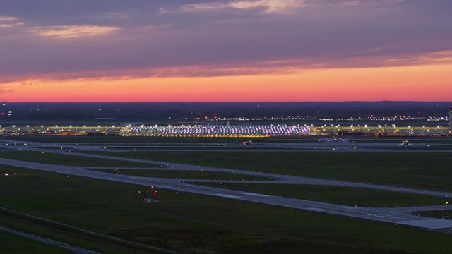 Detroit Michigan Aerial v169 Slow panning sunset view looking at airport terminal with bright pink sky - October 2017