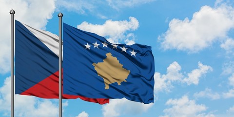 Czech Republic and Kosovo flag waving in the wind against white cloudy blue sky together. Diplomacy concept, international relations.