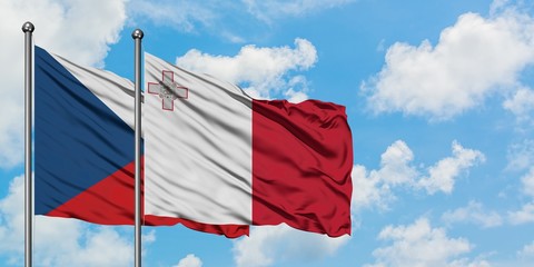 Czech Republic and Malta flag waving in the wind against white cloudy blue sky together. Diplomacy concept, international relations.