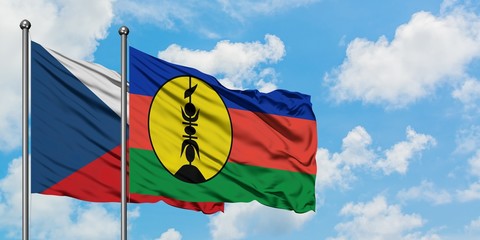 Czech Republic and New Caledonia flag waving in the wind against white cloudy blue sky together. Diplomacy concept, international relations.