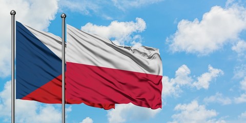 Czech Republic and Poland flag waving in the wind against white cloudy blue sky together. Diplomacy concept, international relations.