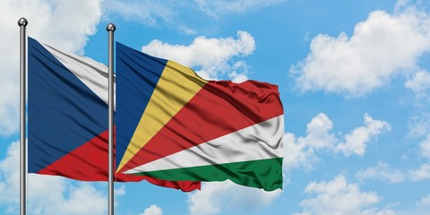 Czech Republic and Seychelles flag waving in the wind against white cloudy blue sky together. Diplomacy concept, international relations.
