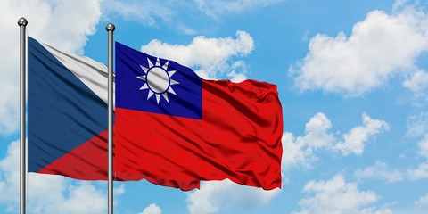 Czech Republic and Taiwan flag waving in the wind against white cloudy blue sky together. Diplomacy concept, international relations.