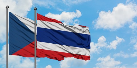 Czech Republic and Thailand flag waving in the wind against white cloudy blue sky together. Diplomacy concept, international relations.