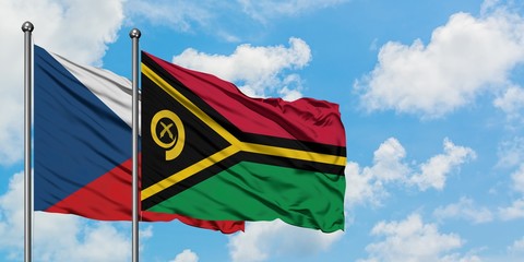 Czech Republic and Vanuatu flag waving in the wind against white cloudy blue sky together....
