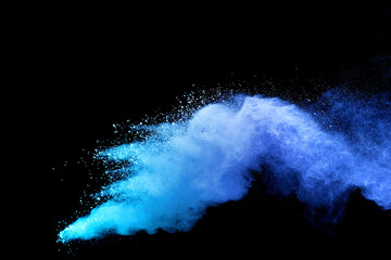 Blue sky color powder explosion on black background.