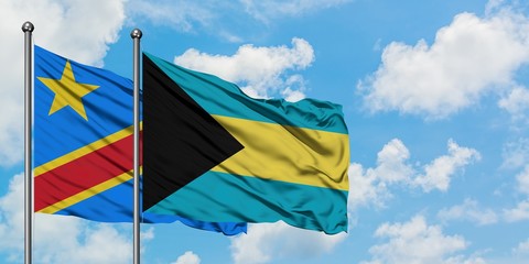 Congo and Bahamas flag waving in the wind against white cloudy blue sky together. Diplomacy concept, international relations.