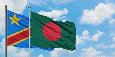 Congo and Bangladesh flag waving in the wind against white cloudy blue sky together. Diplomacy concept, international relations.