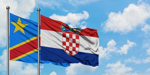 Congo and Croatia flag waving in the wind against white cloudy blue sky together. Diplomacy concept, international relations.