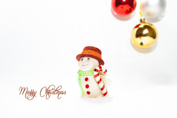 Christmas card, illustration with golden baubles, balls, decorations, ornaments on a silver white background with blurry, blurred, lights (bokeh), soft, neutral, warm colors and Merry Christmas text