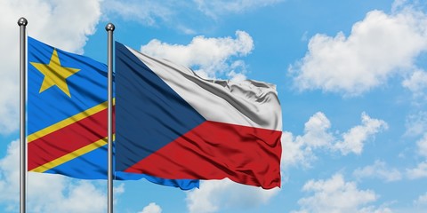 Congo and Czech Republic flag waving in the wind against white cloudy blue sky together. Diplomacy concept, international relations.