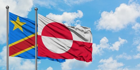 Congo and Greenland flag waving in the wind against white cloudy blue sky together. Diplomacy concept, international relations.