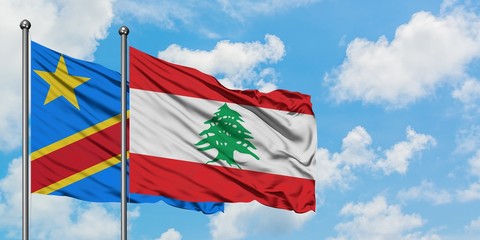 Congo and Lebanon flag waving in the wind against white cloudy blue sky together. Diplomacy concept, international relations.
