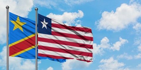 Congo and Liberia flag waving in the wind against white cloudy blue sky together. Diplomacy concept, international relations.