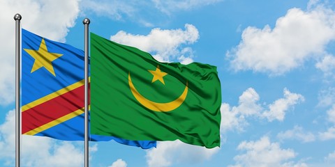 Congo and Mauritania flag waving in the wind against white cloudy blue sky together. Diplomacy concept, international relations.