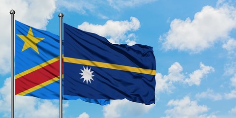 Congo and Nauru flag waving in the wind against white cloudy blue sky together. Diplomacy concept, international relations.
