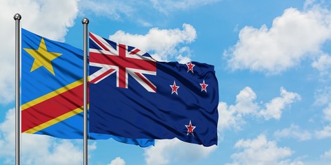 Congo and New Zealand flag waving in the wind against white cloudy blue sky together. Diplomacy concept, international relations.