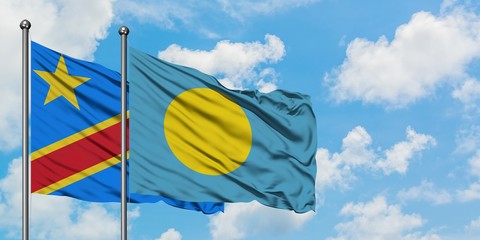 Congo and Palau flag waving in the wind against white cloudy blue sky together. Diplomacy concept, international relations.