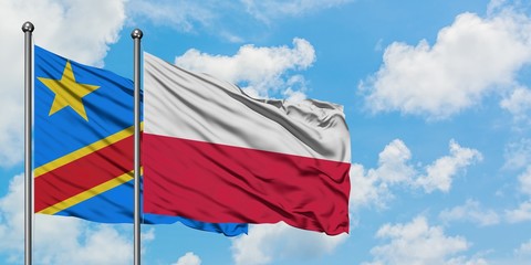 Congo and Poland flag waving in the wind against white cloudy blue sky together. Diplomacy concept, international relations.