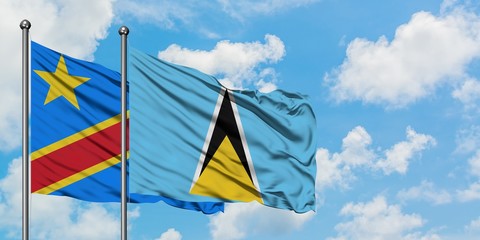Congo and Saint Lucia flag waving in the wind against white cloudy blue sky together. Diplomacy concept, international relations.