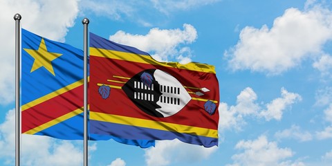 Congo and Swaziland flag waving in the wind against white cloudy blue sky together. Diplomacy concept, international relations.