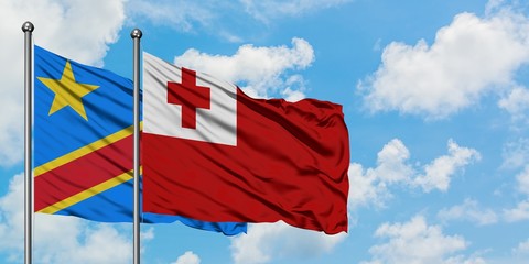 Congo and Tonga flag waving in the wind against white cloudy blue sky together. Diplomacy concept, international relations.