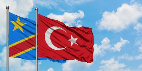 Congo and Turkey flag waving in the wind against white cloudy blue sky together. Diplomacy concept,...