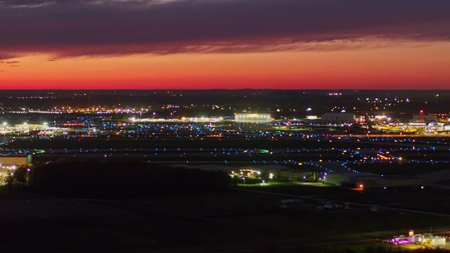 Detroit Michigan Aerial v174 Plane and car traffic focused airport cityscape at sunset dusk - October 2017