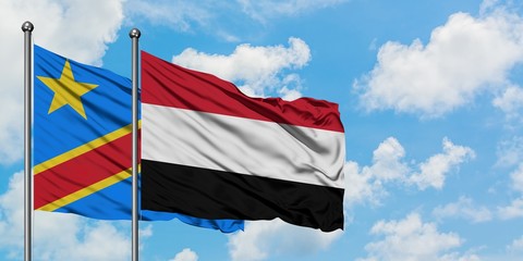 Congo and Yemen flag waving in the wind against white cloudy blue sky together. Diplomacy concept, international relations.
