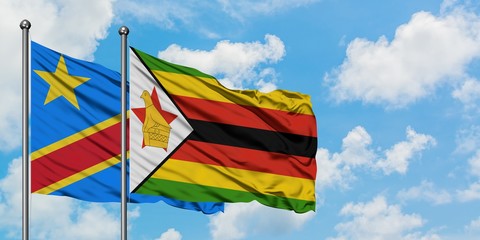 Congo and Zimbabwe flag waving in the wind against white cloudy blue sky together. Diplomacy concept, international relations.
