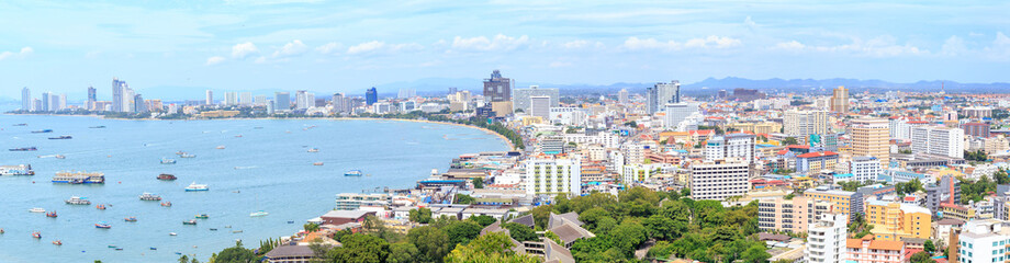 Panorama landscape photo of Pattaya cityscape and bay or harbor at Chonburi Province, Thailand.