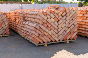 Brown bricks stacked together to build a house