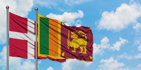 Denmark and Sri Lanka flag waving in the wind against white cloudy blue sky together. Diplomacy concept, international relations.