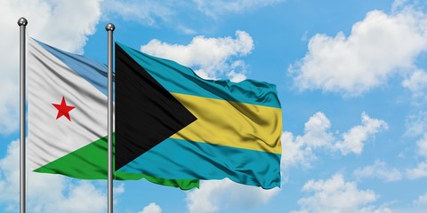 Djibouti and Bahamas flag waving in the wind against white cloudy blue sky together. Diplomacy concept, international relations.