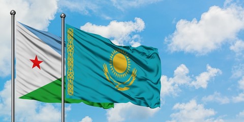 Djibouti and Kazakhstan flag waving in the wind against white cloudy blue sky together. Diplomacy concept, international relations.
