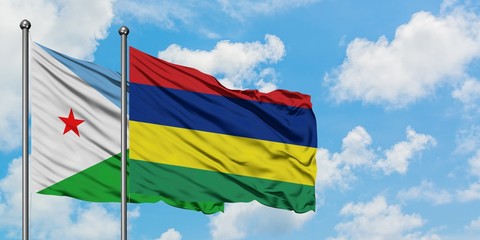 Djibouti and Mauritius flag waving in the wind against white cloudy blue sky together. Diplomacy concept, international relations.
