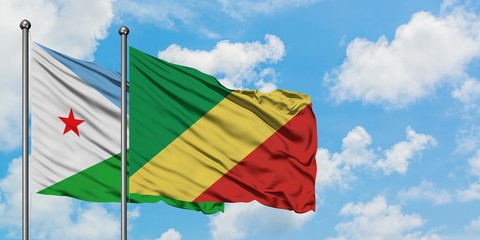 Djibouti and Republic Of The Congo flag waving in the wind against white cloudy blue sky together. Diplomacy concept, international relations.