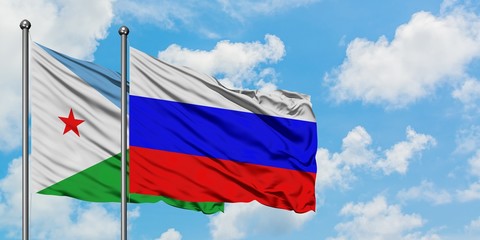 Djibouti and Russia flag waving in the wind against white cloudy blue sky together. Diplomacy concept, international relations.
