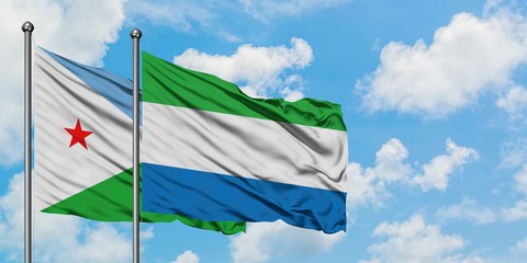 Djibouti and Sierra Leone flag waving in the wind against white cloudy blue sky together. Diplomacy concept, international relations.