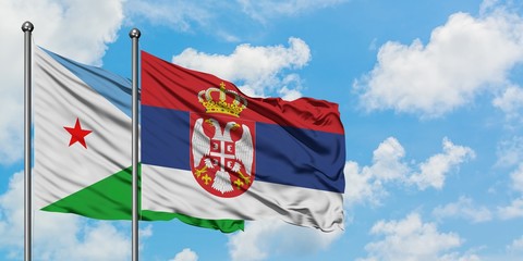 Djibouti and Serbia flag waving in the wind against white cloudy blue sky together. Diplomacy concept, international relations.