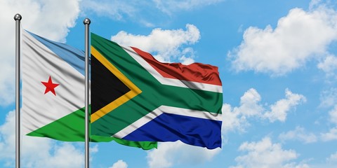 Djibouti and South Africa flag waving in the wind against white cloudy blue sky together. Diplomacy concept, international relations.
