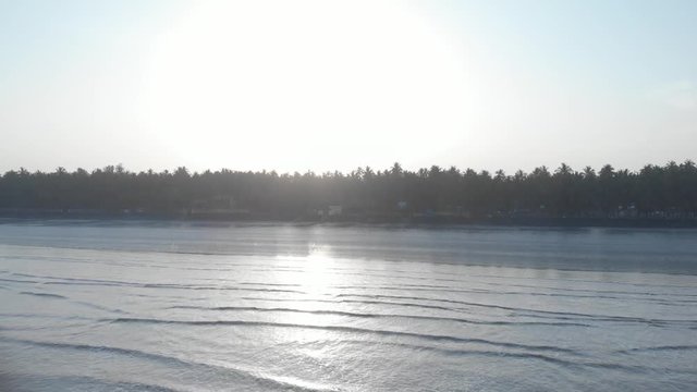 gorai beach black sand blue sky reflecting on wet sand  sunrise