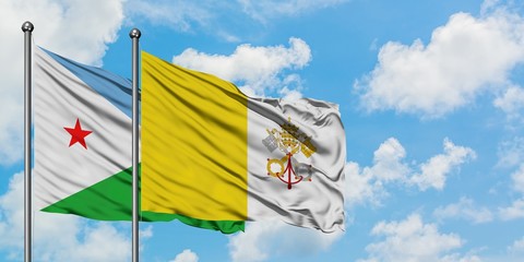 Djibouti and Vatican City flag waving in the wind against white cloudy blue sky together. Diplomacy concept, international relations.