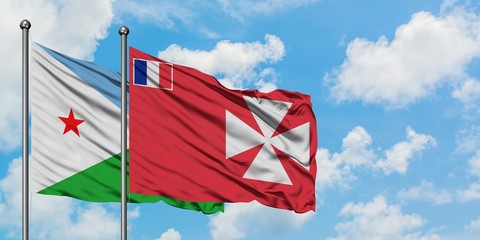 Djibouti and Wallis And Futuna flag waving in the wind against white cloudy blue sky together. Diplomacy concept, international relations.
