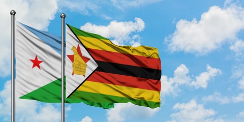 Djibouti and Zimbabwe flag waving in the wind against white cloudy blue sky together. Diplomacy concept, international relations.