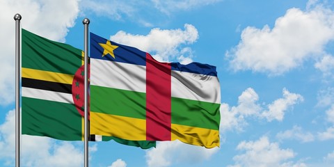 Dominica and Central African Republic flag waving in the wind against white cloudy blue sky together. Diplomacy concept, international relations.