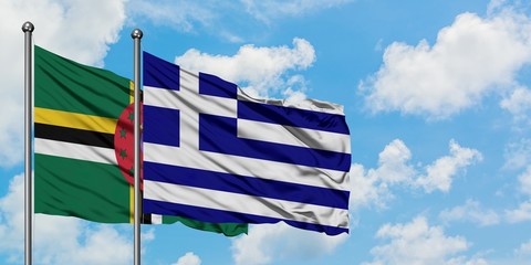 Dominica and Greece flag waving in the wind against white cloudy blue sky together. Diplomacy concept, international relations.